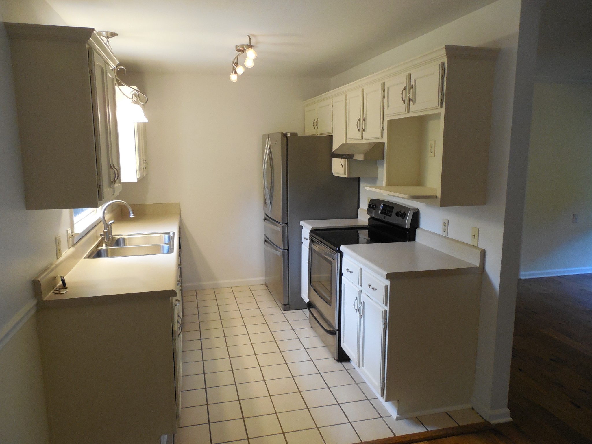 7397 Forest Glenn Road Fairview, TN 37062 - Photo 7 of 16 a kitchen with a sink appliances and cabinets
