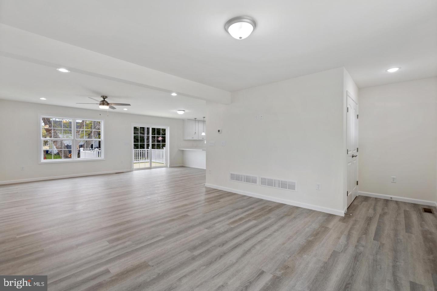 144 Pratts Branch Road Felton, DE 19943 - Photo 11 of 24 an empty room with wooden floor and windows