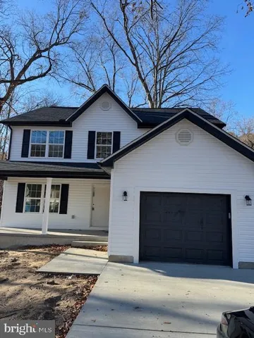 a house with trees in the background