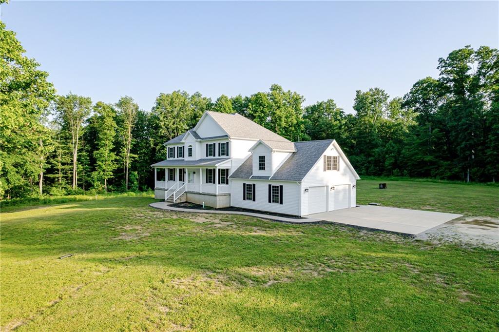 a house that has a big yard with large trees