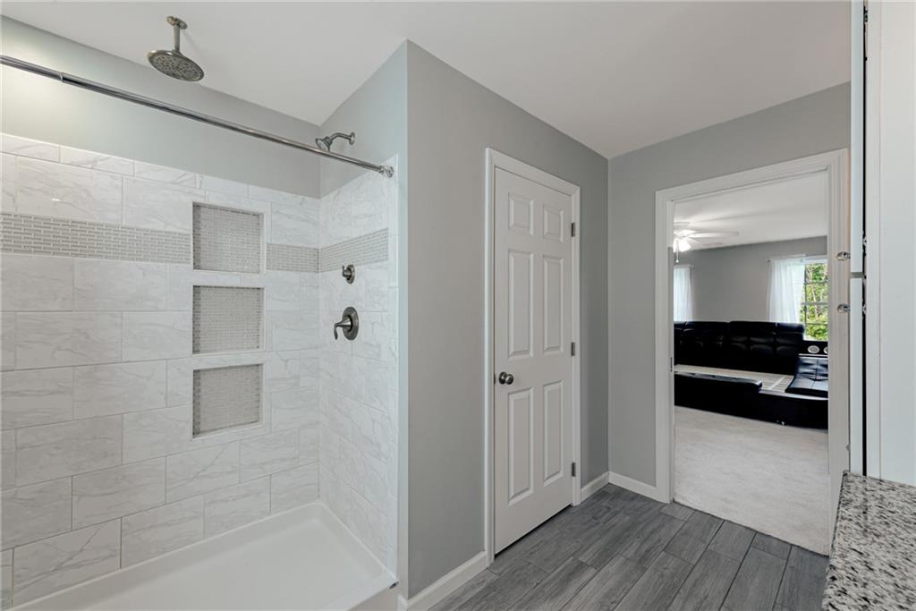 700 Springfield Road Penn Run, PA 15765 - Photo 18 of 25 a bathroom with a bathtub and a shower