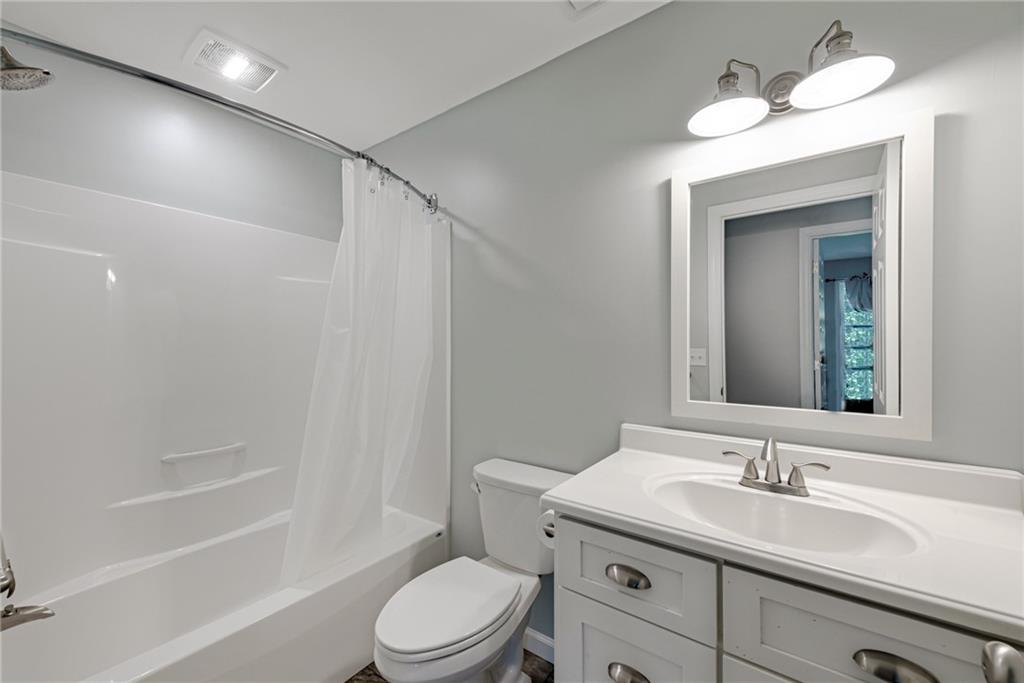 700 Springfield Road Penn Run, PA 15765 - Photo 20 of 25 a bathroom with a granite countertop sink toilet a mirror and shower