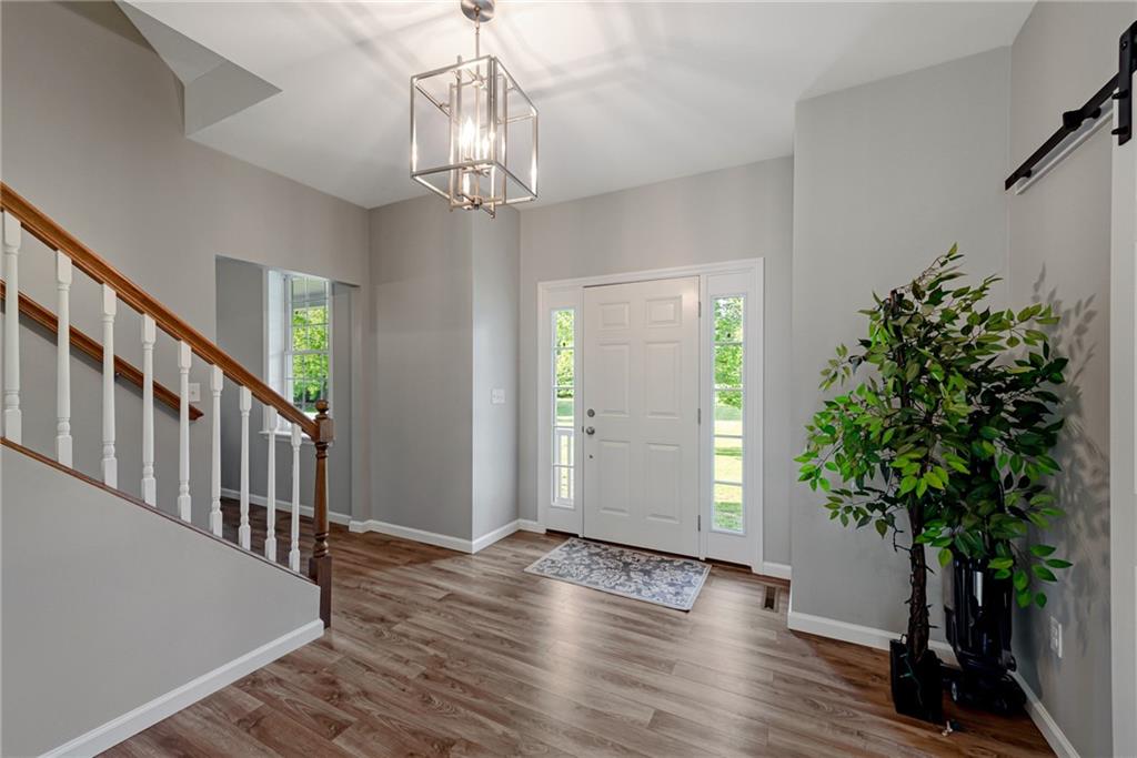 700 Springfield Road Penn Run, PA 15765 - Photo 5 of 25 a view of a room with wooden floor and potted plant