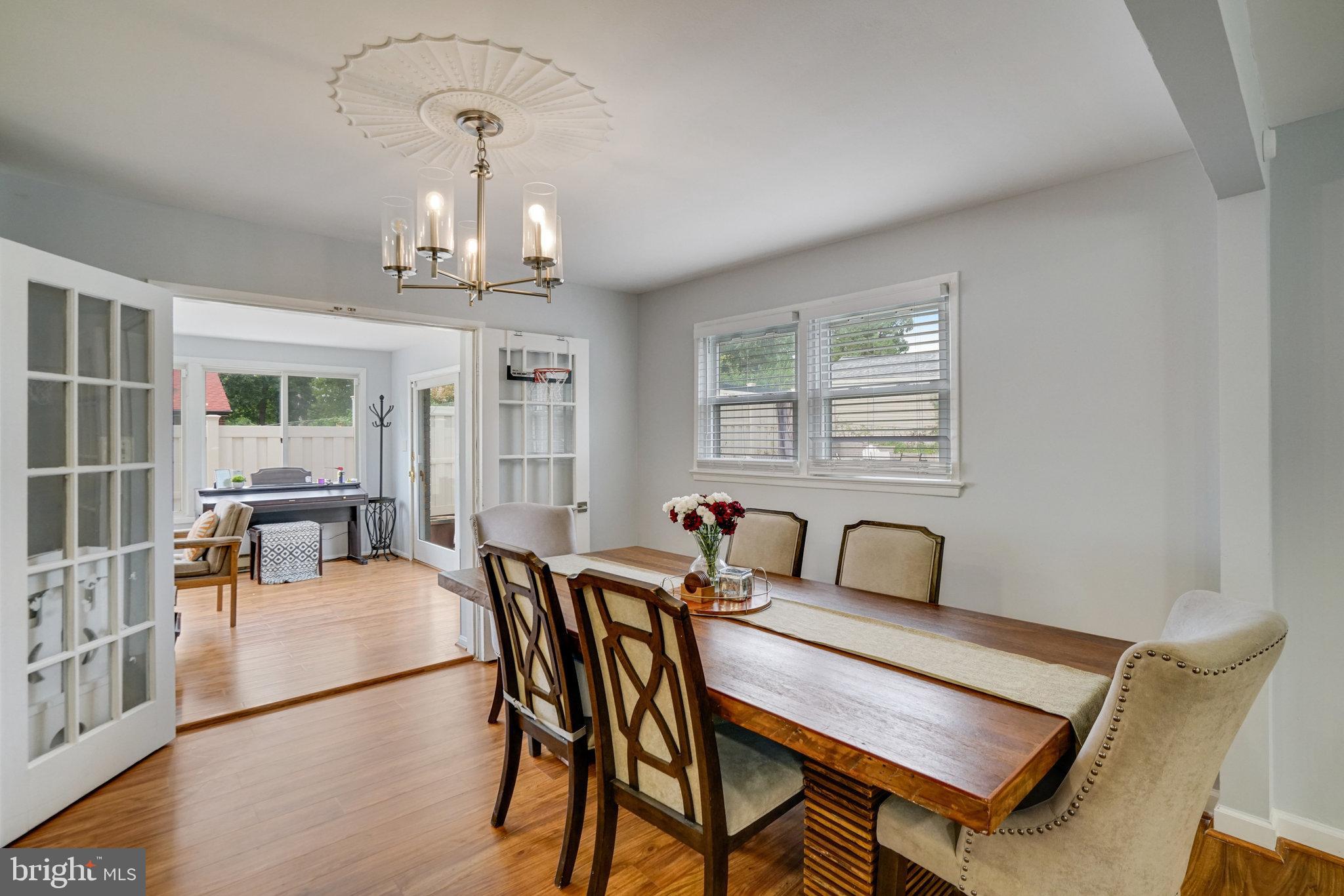 5904 Atteentee Road Springfield, VA 22150 - Photo 11 of 51 a view of a dining room with furniture window and wooden floor