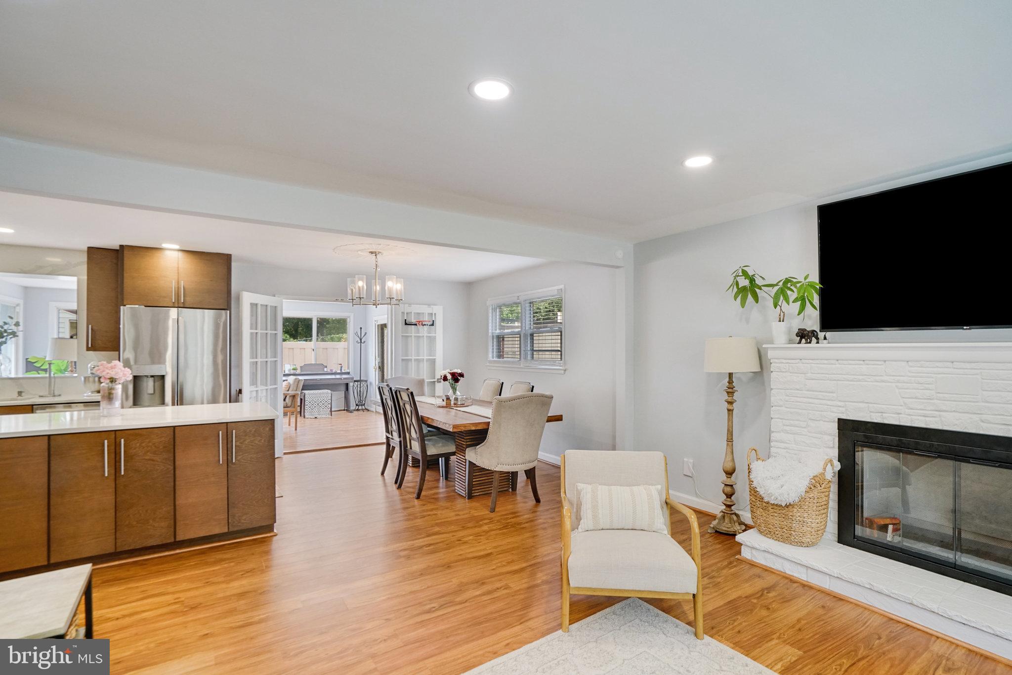 5904 Atteentee Road Springfield, VA 22150 - Photo 17 of 51 a living room with fireplace furniture and a flat screen tv
