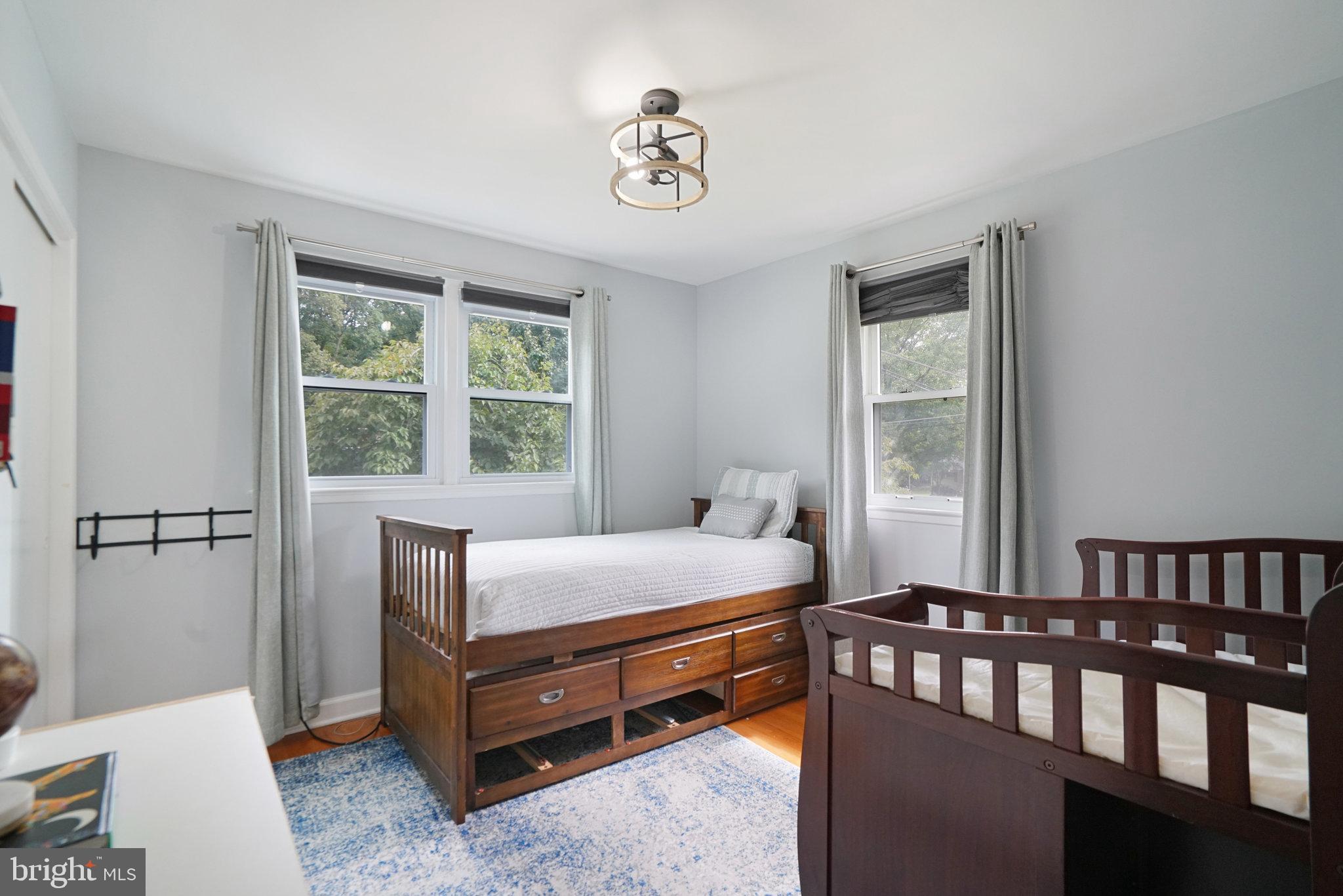 5904 Atteentee Road Springfield, VA 22150 - Photo 20 of 51 a bedroom with a bed and a window