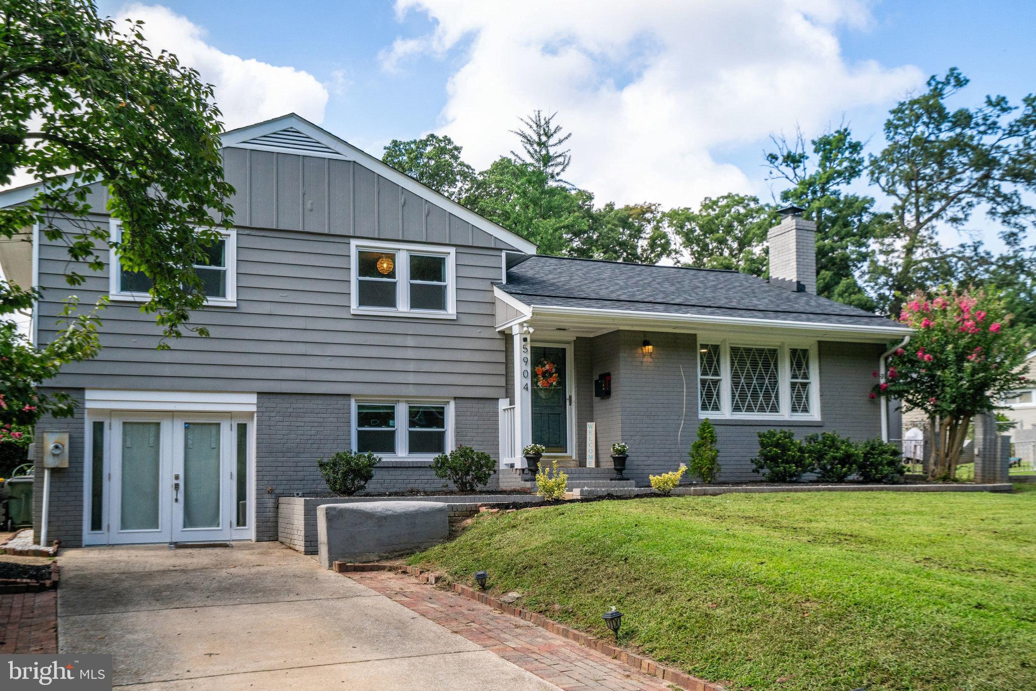 5904 Atteentee Road Springfield, VA 22150 - Photo 2 of 51 a front view of a house with garden