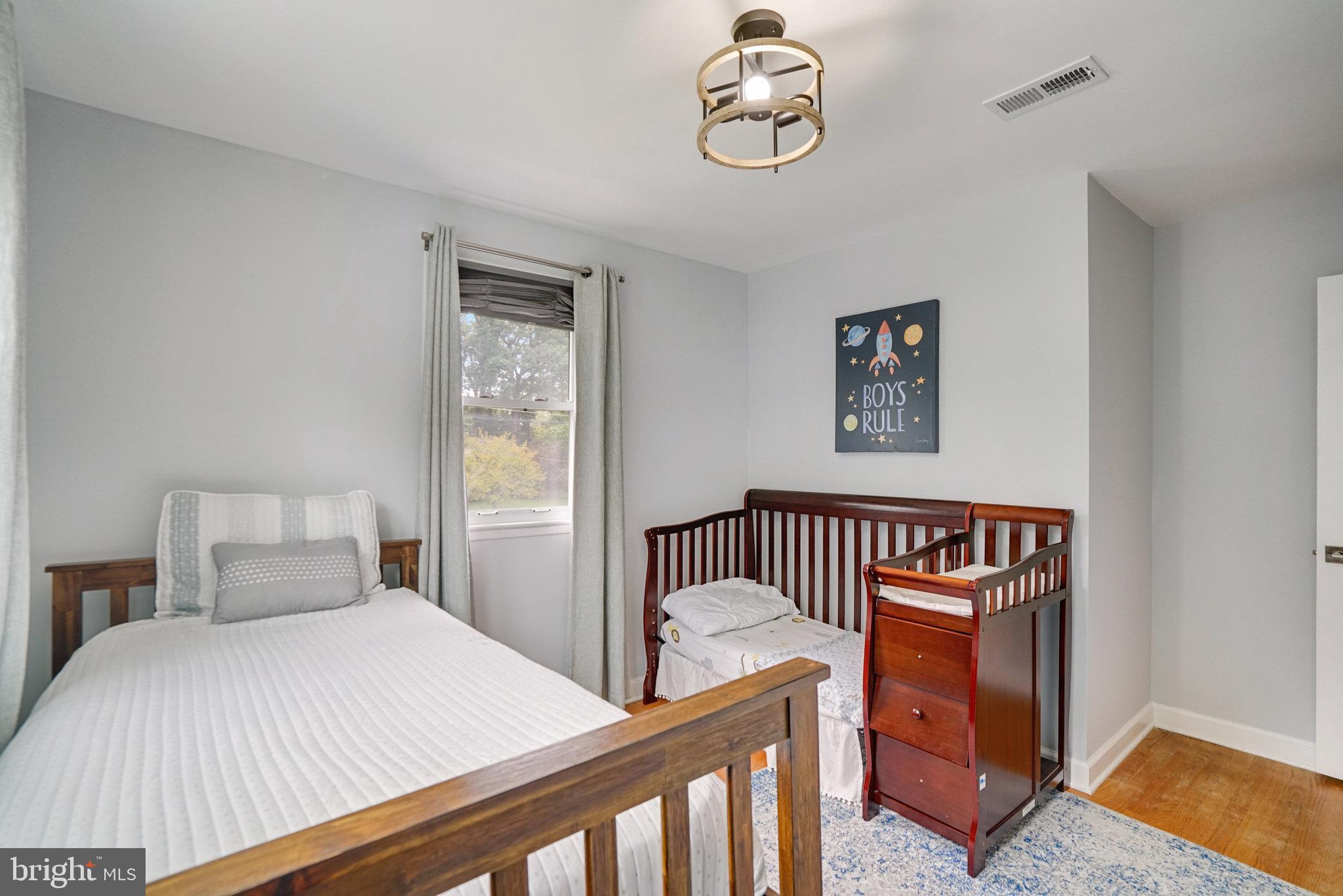 5904 Atteentee Road Springfield, VA 22150 - Photo 21 of 51 a bedroom with a bed and a window