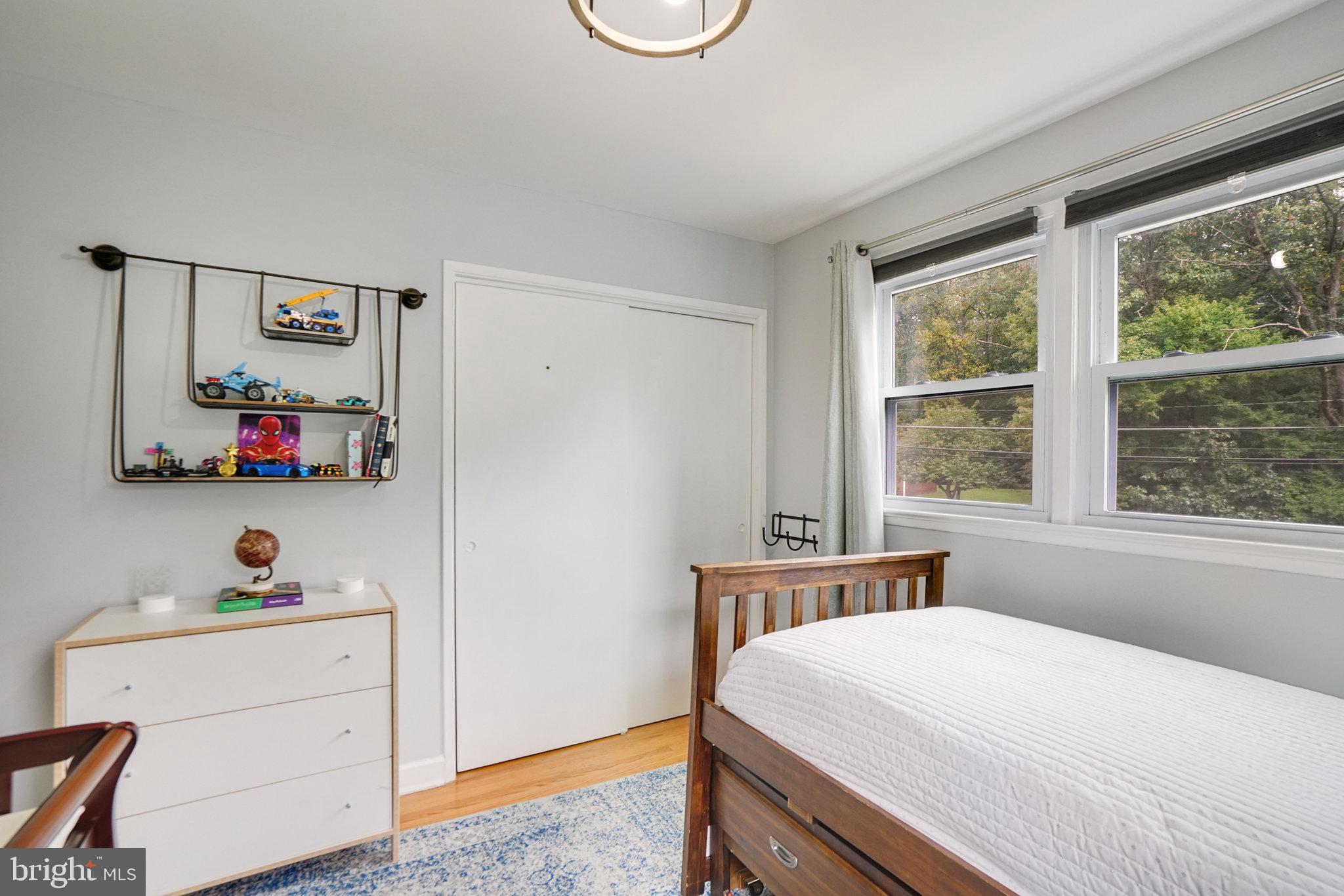 5904 Atteentee Road Springfield, VA 22150 - Photo 22 of 51 a bedroom with a bed and a window