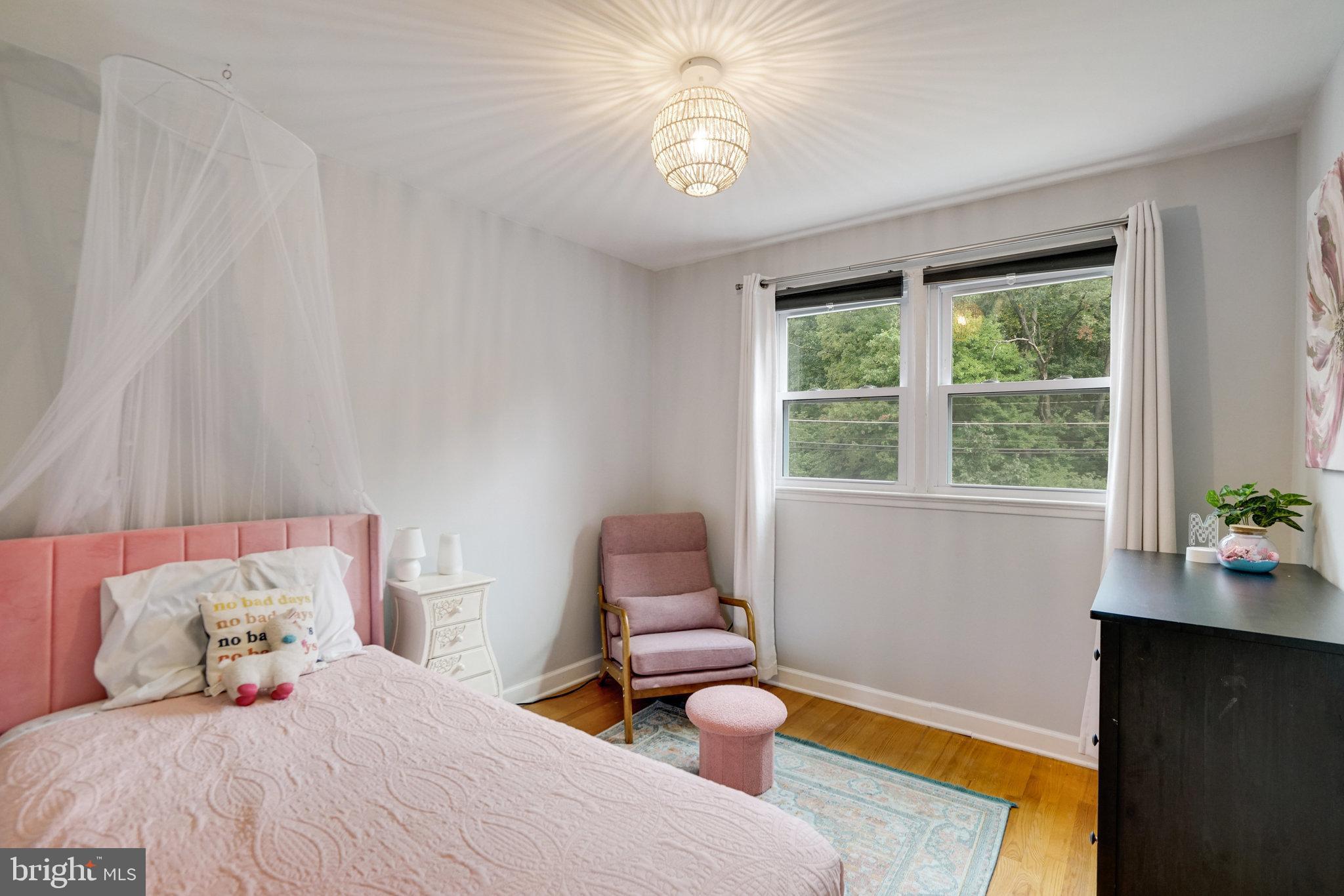 5904 Atteentee Road Springfield, VA 22150 - Photo 23 of 51 a bedroom with a bed and a window