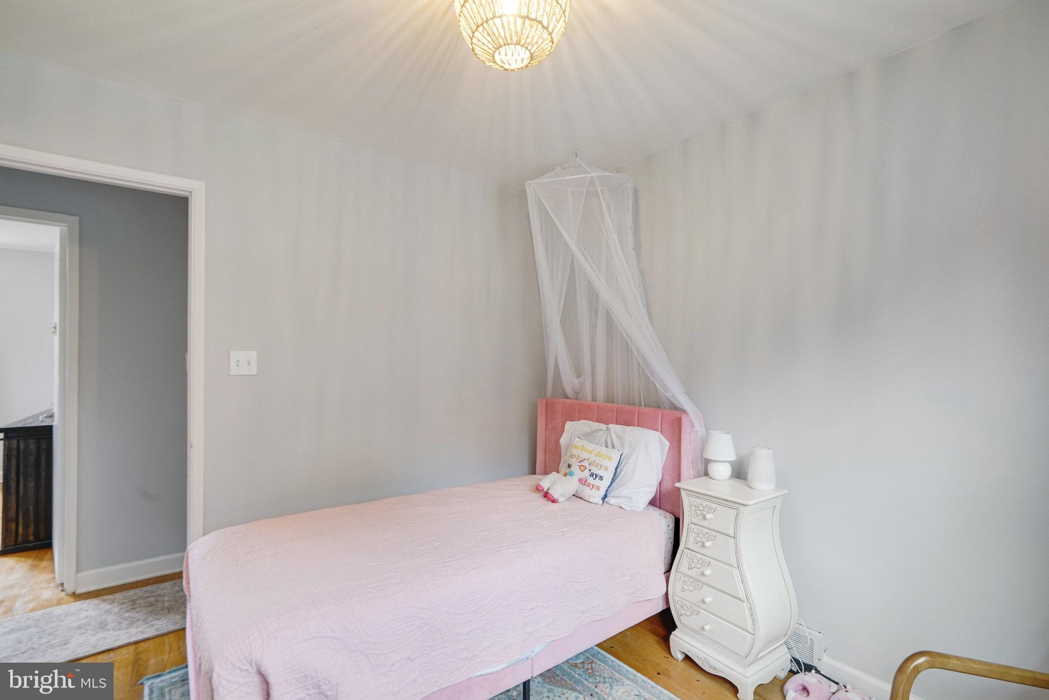 5904 Atteentee Road Springfield, VA 22150 - Photo 24 of 51 a bedroom with a bed and a window