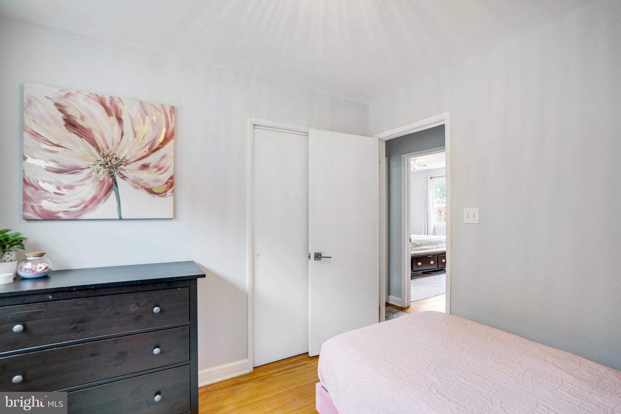 5904 Atteentee Road Springfield, VA 22150 - Photo 25 of 51 a bedroom with a bed and a painting on the wall