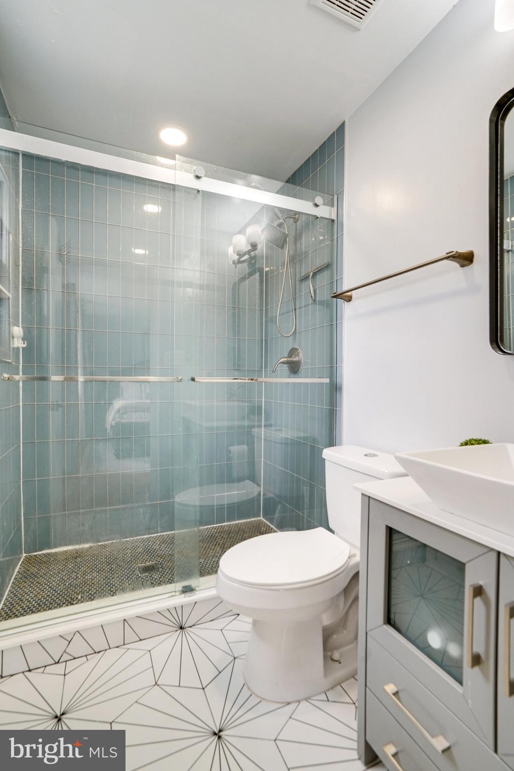 5904 Atteentee Road Springfield, VA 22150 - Photo 30 of 51 a bathroom with a shower a toilet and a sink