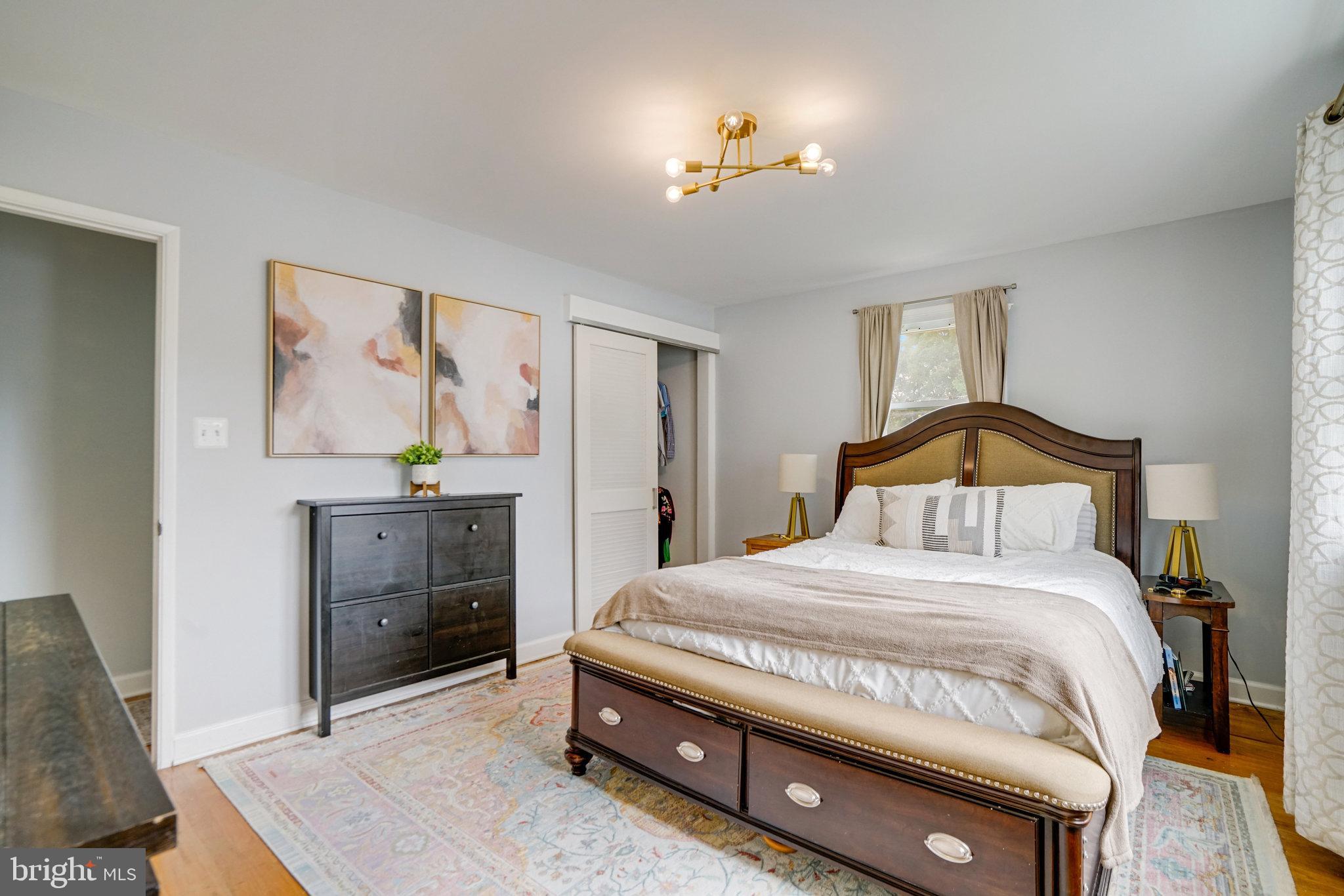 5904 Atteentee Road Springfield, VA 22150 - Photo 31 of 51 a bedroom with a bed and a dresser