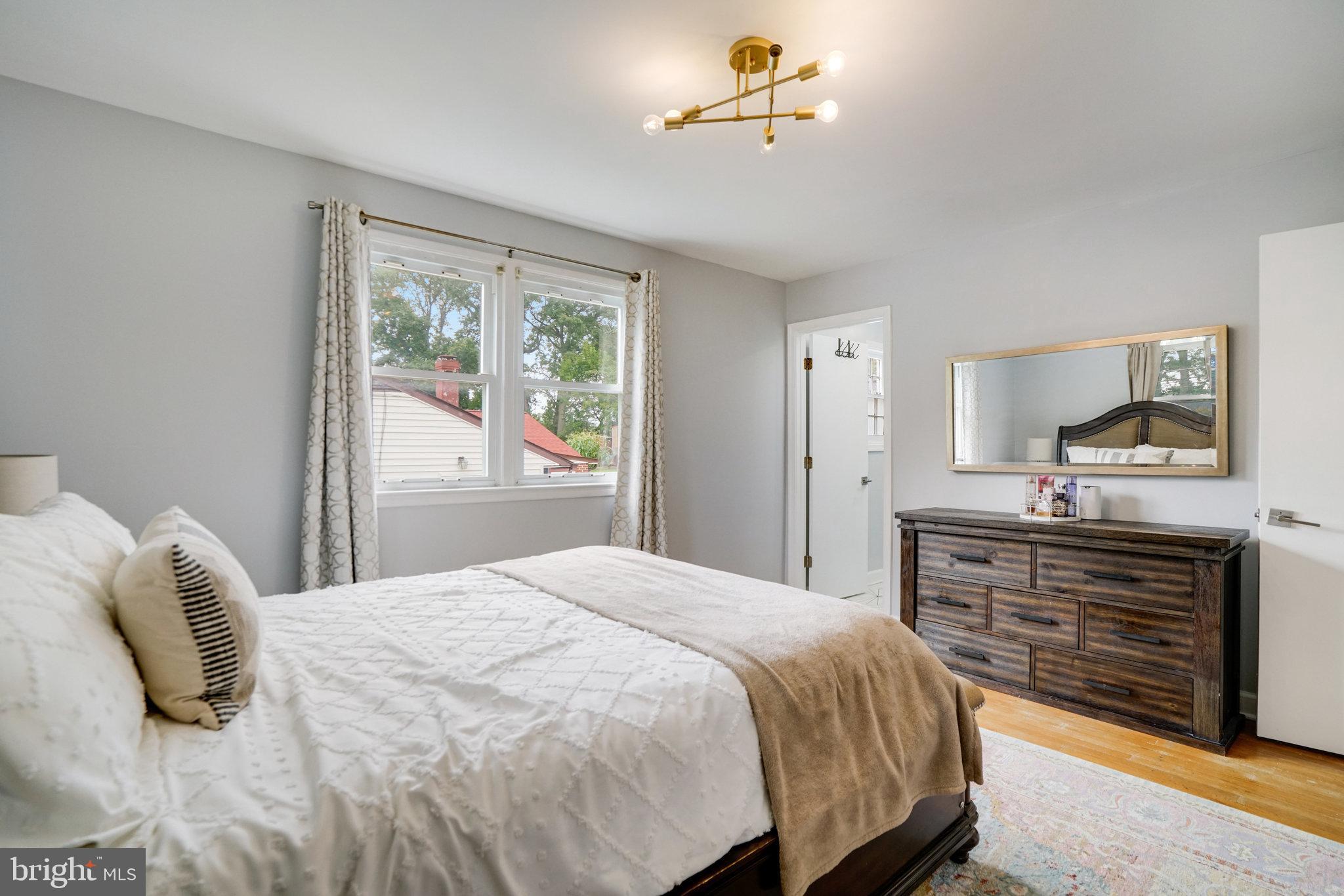 5904 Atteentee Road Springfield, VA 22150 - Photo 33 of 51 a bedroom with a bed and a dresser