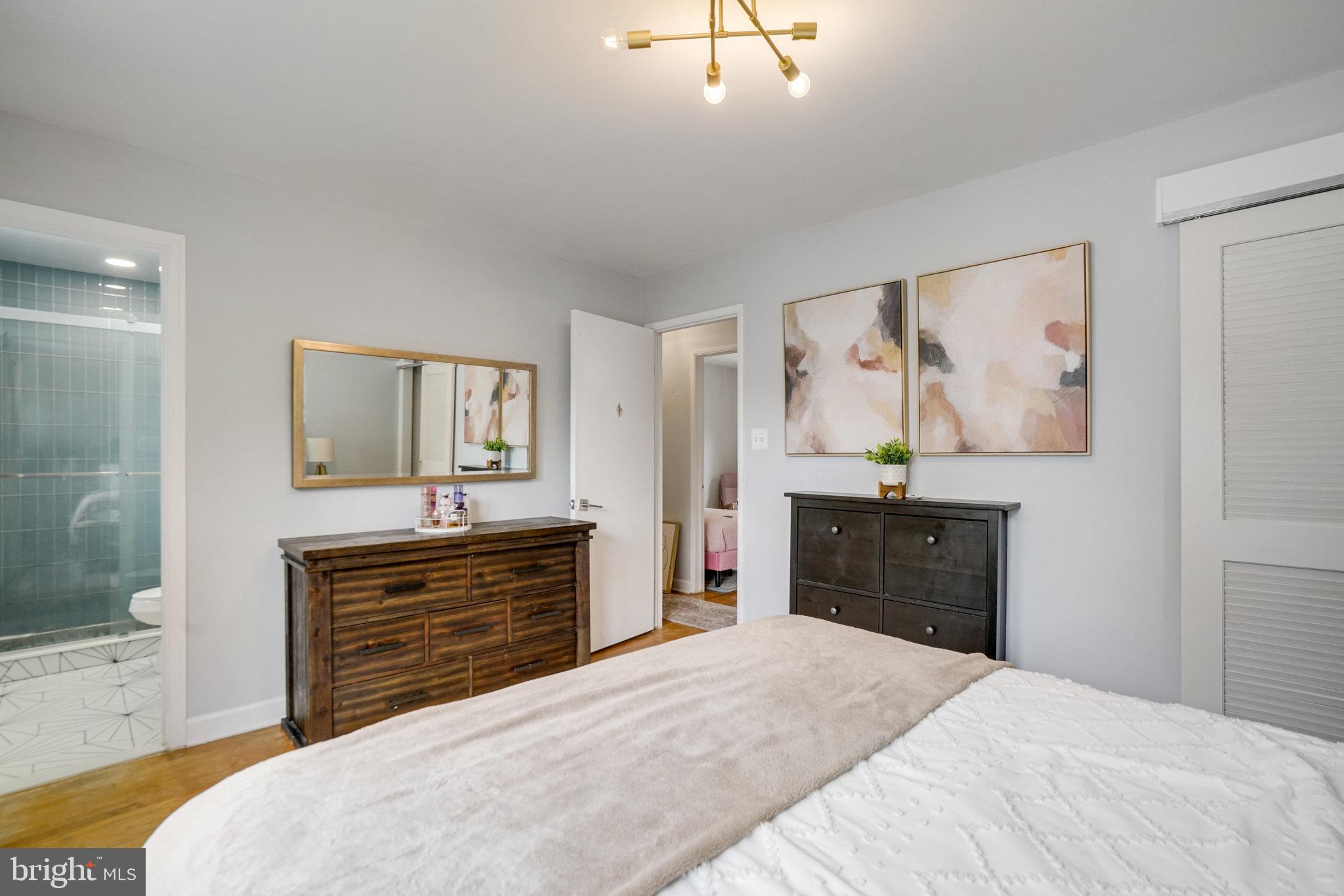 5904 Atteentee Road Springfield, VA 22150 - Photo 34 of 51 a bedroom with a bed and a dresser