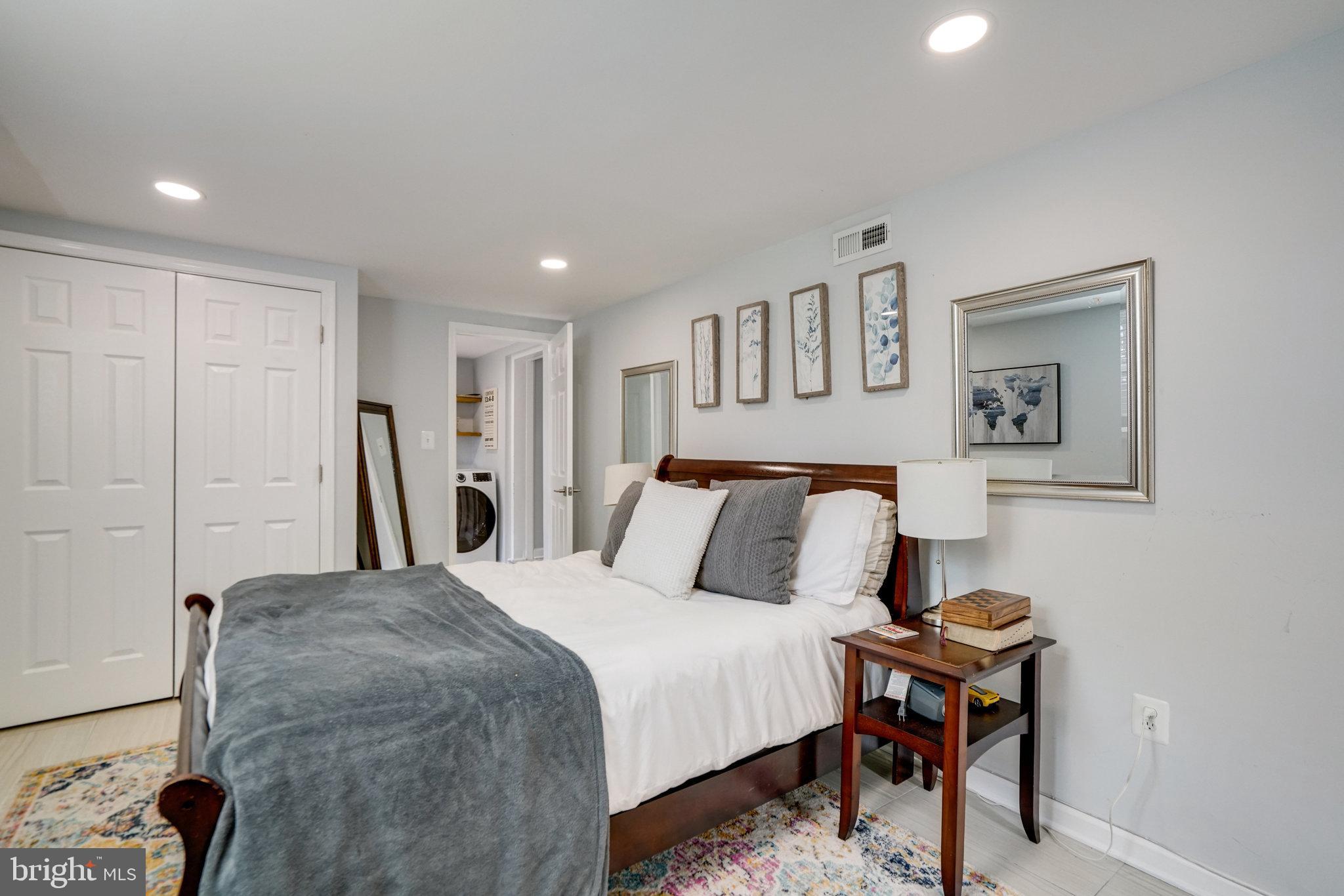 5904 Atteentee Road Springfield, VA 22150 - Photo 43 of 51 a bedroom with a bed and a table in it