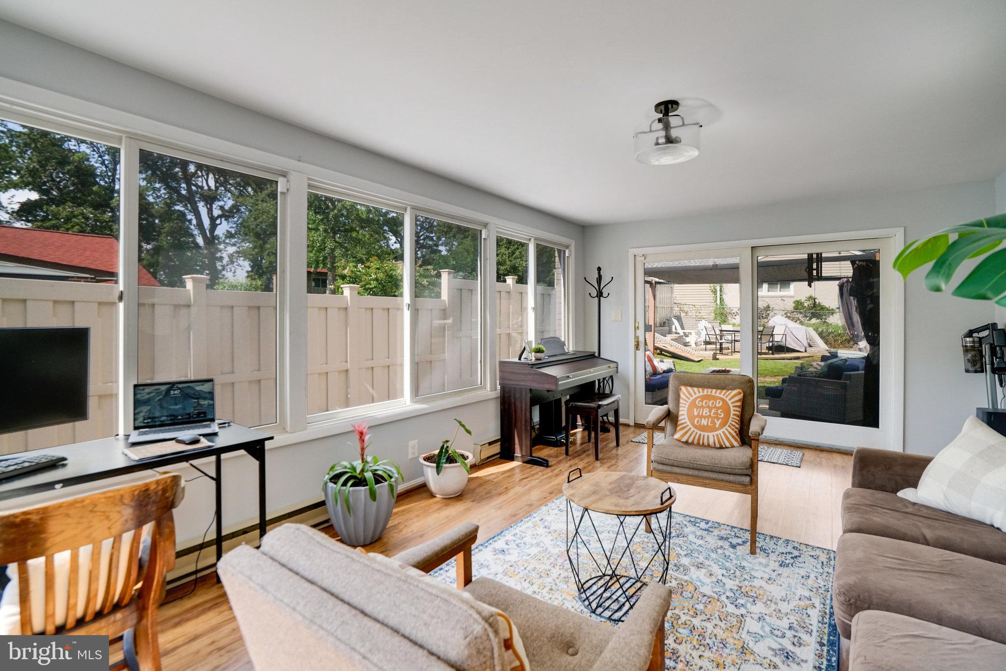 5904 Atteentee Road Springfield, VA 22150 - Photo 45 of 51 a living room with fireplace furniture and a floor to ceiling window