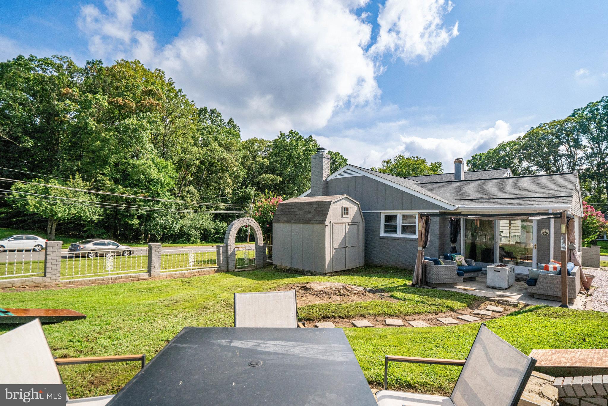 5904 Atteentee Road Springfield, VA 22150 - Photo 49 of 51 a view of a house with swimming pool and a yard