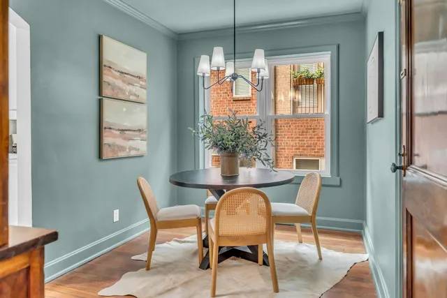 a dining room with furniture and window