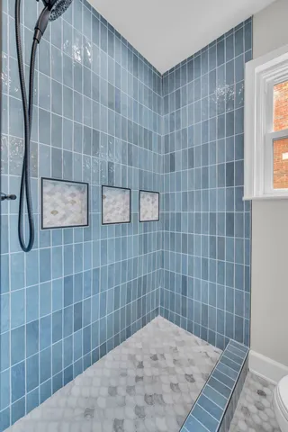 a front view of a house with yard and green space