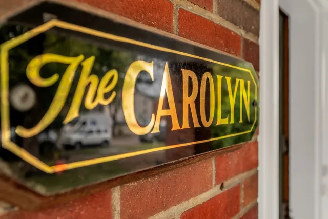 a view of entryway with hall and wooden floor