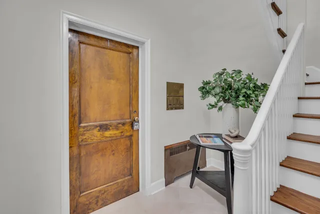 a living room with furniture potted plant and a window