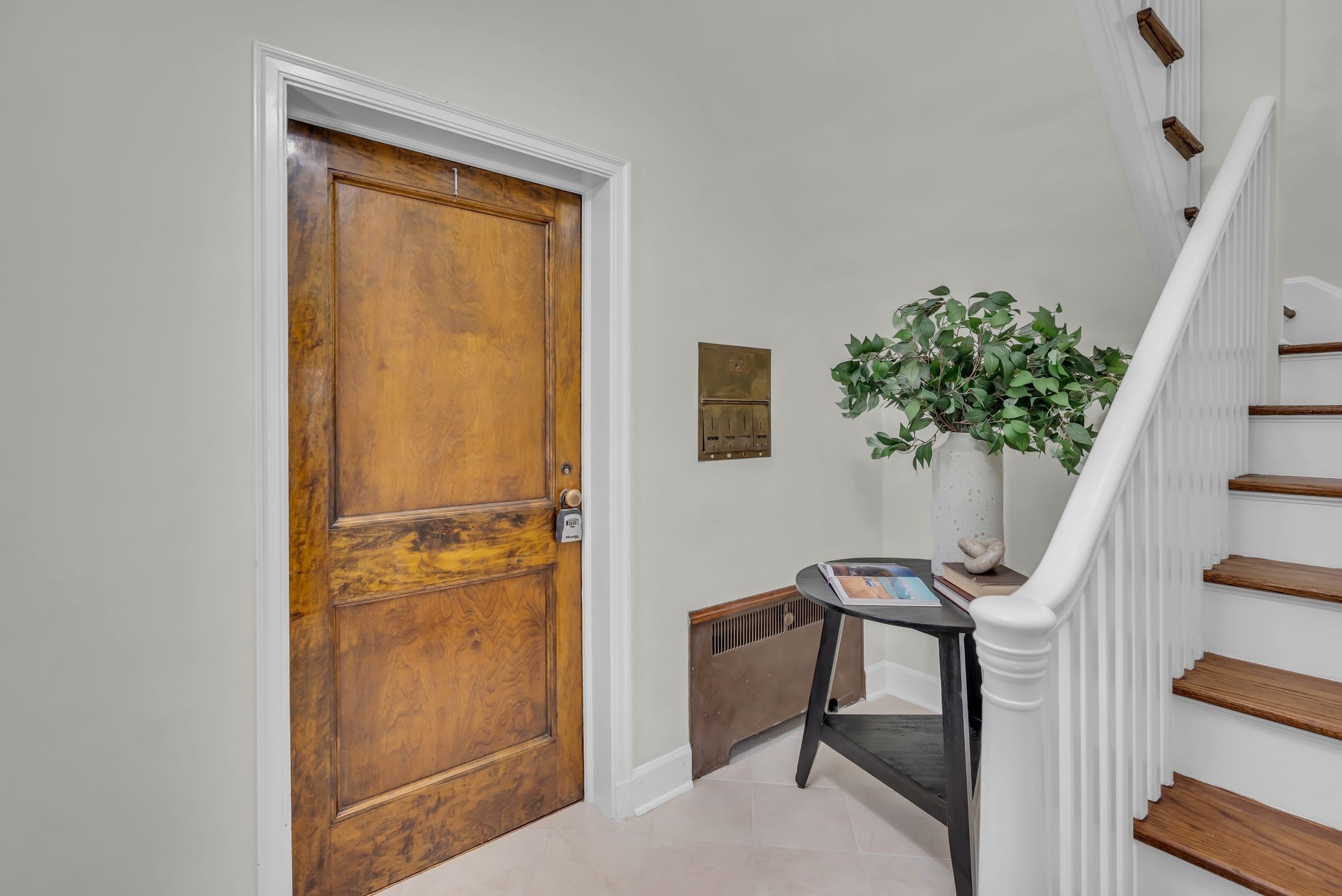 2003 Convent Place, Unit 1 Nashville, TN 37212 - Photo 8 of 34 a view of a hallway with furniture and a potted plant