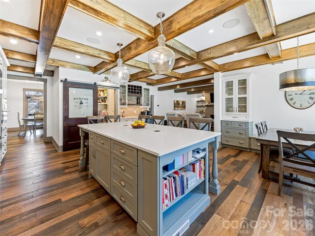 a kitchen with a stove a sink and a refrigerator