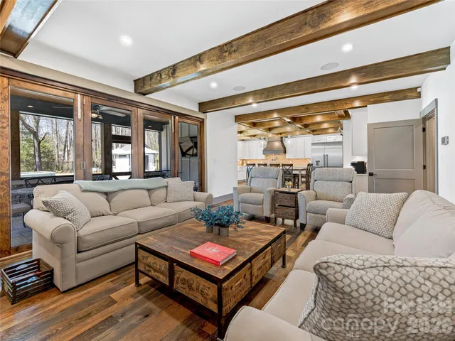 a dining room with furniture and wooden floor