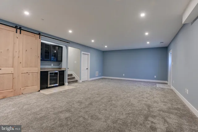 a view of an empty room with an empty room and fire place