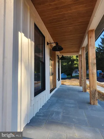 a view of backyard with porch