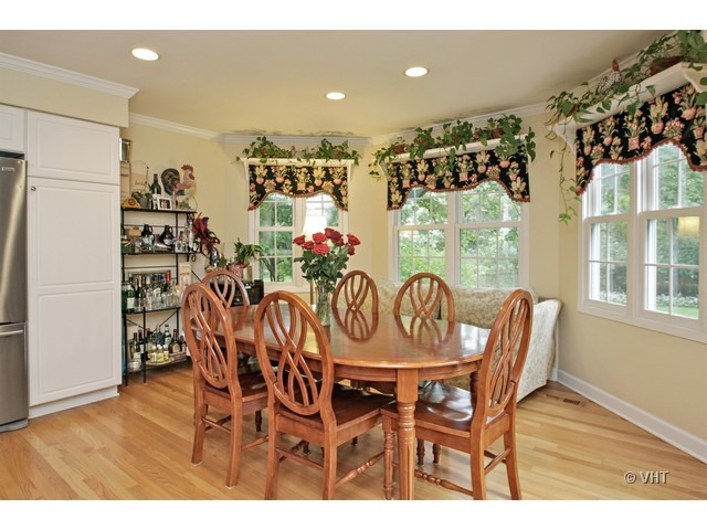 1460 Edgewood Road Lake Forest, IL 60045 - Photo 9 of 21 a view of a dining room with furniture and chandelier