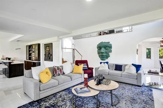 a dining room with furniture a window and a chandelier