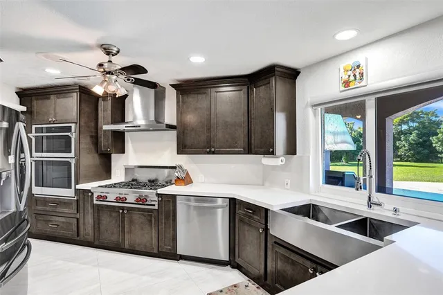 a living room with furniture ceiling fan and a rug