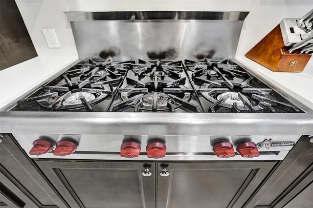 a view of a livingroom with wooden floor and furniture