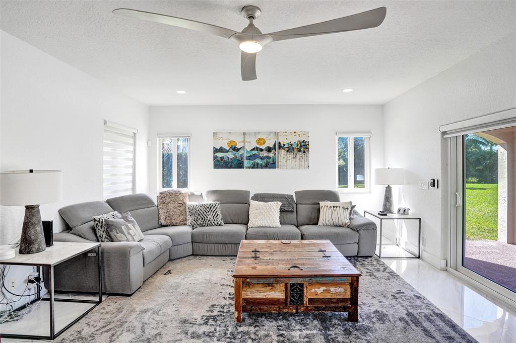 3061 Southwest 117th Avenue Davie, FL 33330 - Photo 23 of 83 a living room with furniture ceiling fan and a rug