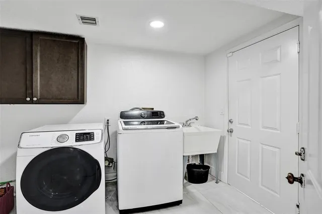 a spacious bedroom with a large bed and a large window