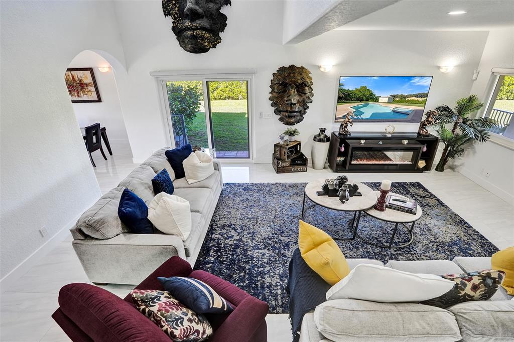 3061 Southwest 117th Avenue Davie, FL 33330 - Photo 26 of 83 a living room with furniture and a flat screen tv