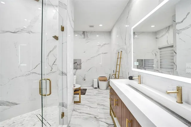 a bedroom with a bed and a walk in closet