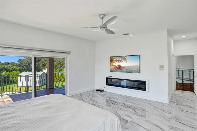 a front view of a house with yard and green space
