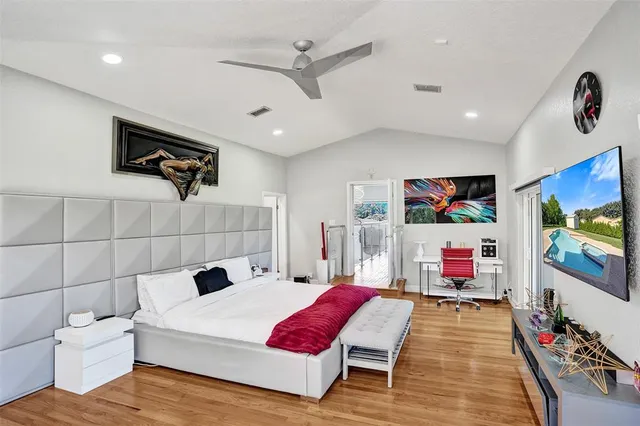 an aerial view of a houses with a yard