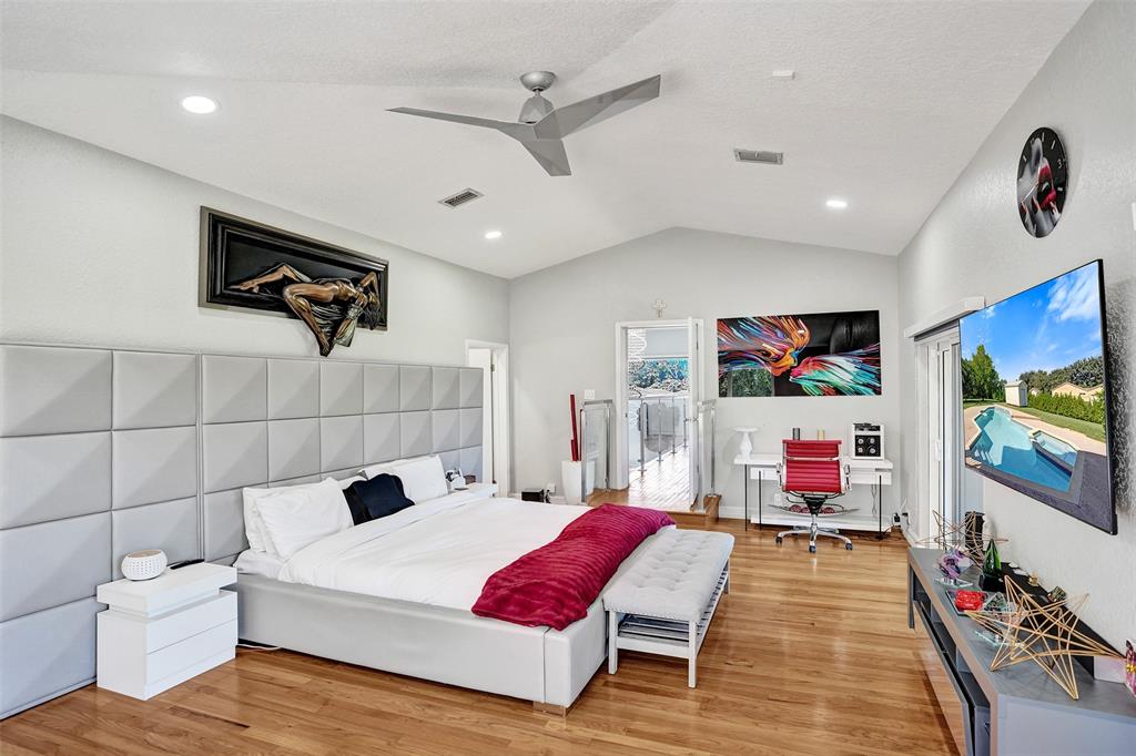 3061 Southwest 117th Avenue Davie, FL 33330 - Photo 47 of 83 a bedroom with a bed and a flat screen tv