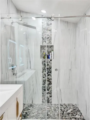 an aerial view of a residential houses with outdoor space and street view