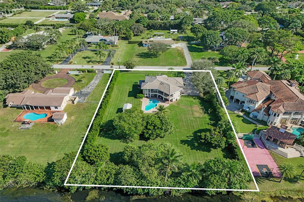 3061 Southwest 117th Avenue Davie, FL 33330 - Photo 68 of 83 an aerial view of residential houses with outdoor space and street view