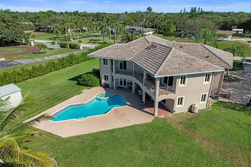 3061 Southwest 117th Avenue Davie, FL 33330 - Photo 69 of 83 a view of a house with a big yard and large trees