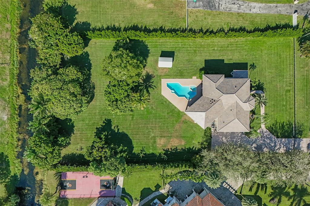 3061 Southwest 117th Avenue Davie, FL 33330 - Photo 74 of 83 an aerial view of a house with garden space and lake view