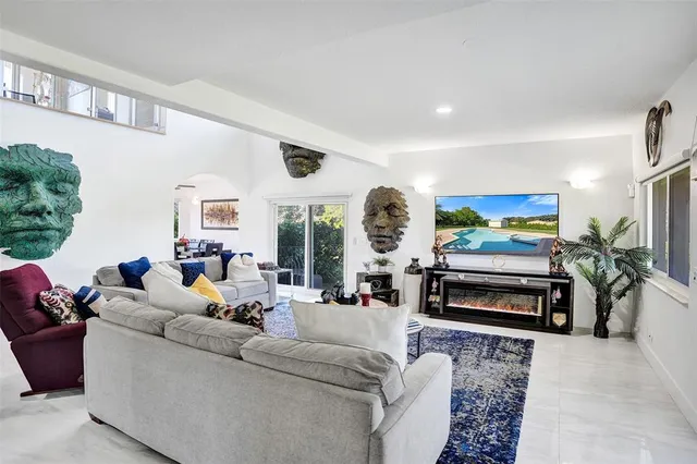 a living room with furniture fireplace and rug