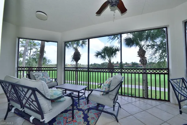 a view of a chair and table in balcony