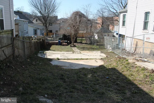 a view of a backyard of the house
